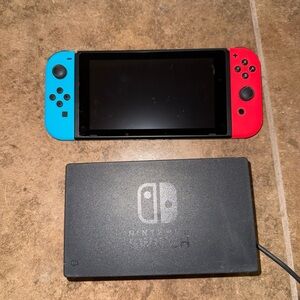 Nintendo Switch Console with Neon Blue and Red Joy-Con